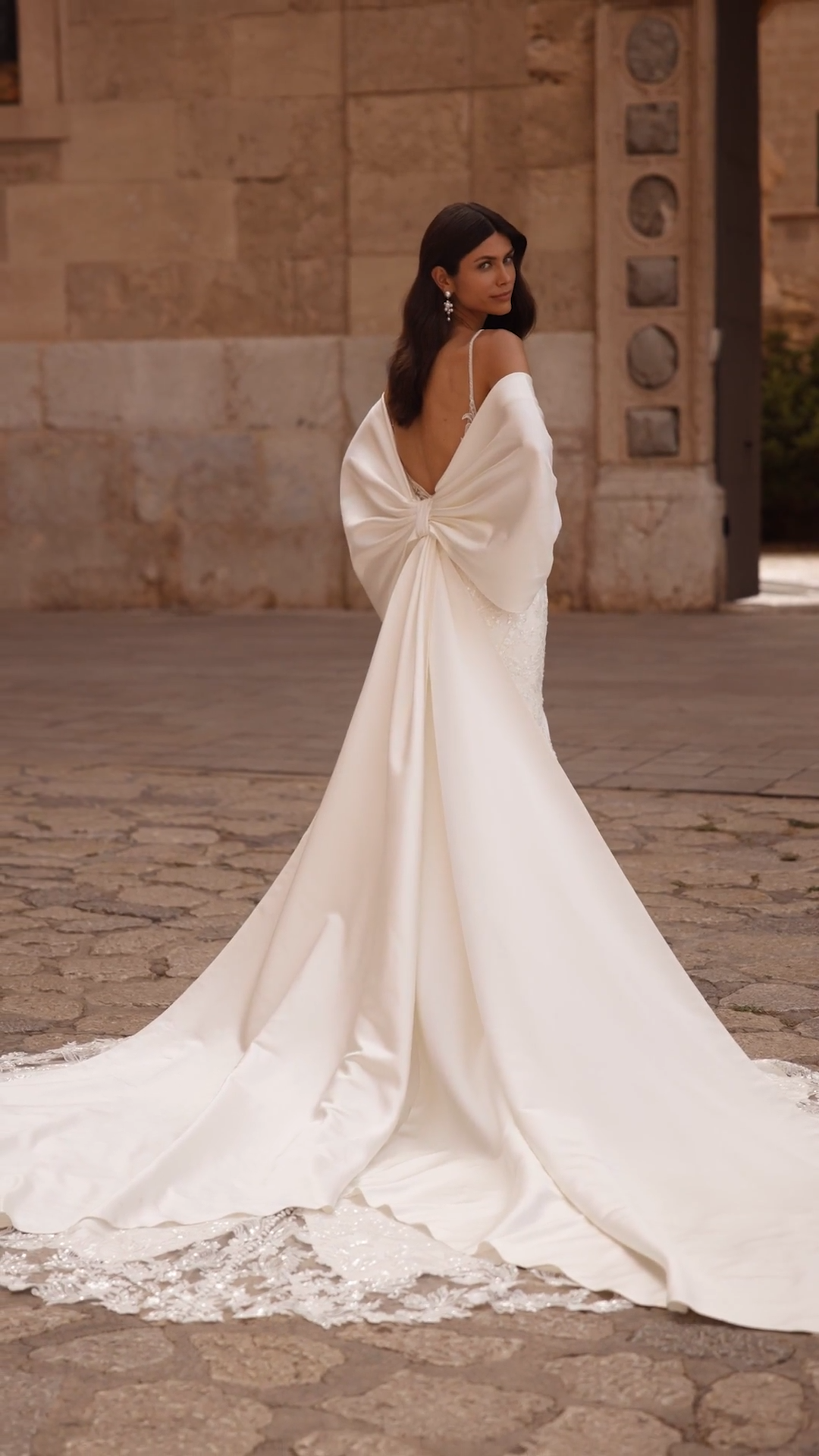 Satin and lace mermaid wedding dress with detachable cathedral bow train Satin and lace mermaid wedding dress with detachable cathedral bow train