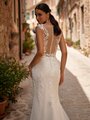 Close up of bride's illusion back wedding dress with buttons and loops along the back